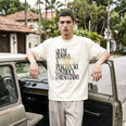 Camiseta Oversized Quem Domina a Percepção, Controla o Resultado Masculina Off-White