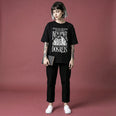Camiseta Oversized Vivemos no Capitalismo Feminina Preto